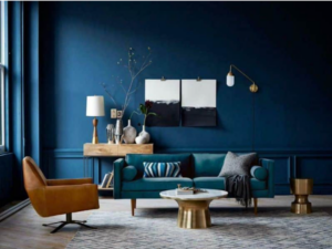 A predominantly blue room and furnishings are complemented by acontrasting warm rusty brown and brass gold, as an example of using after image color theory in interior design.