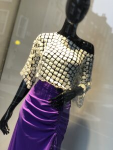 A photo of a London storefront taken by Color  Expert Leatrice Eiseman, showing a mannequin in a white top and purple skirt.
