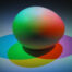 An egg-shaped item with red, yellow, and blue light on it, showing the principles of color mixing