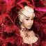 Cardi B surrounded by red feathers, photographed at Paris Fashion Week in 2025